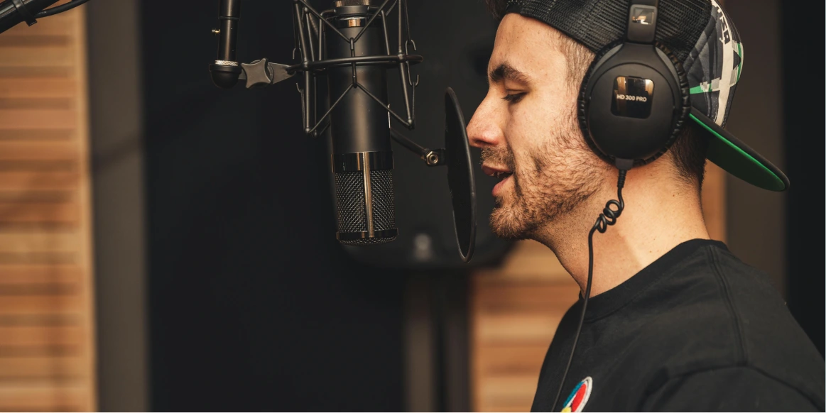 Person recording music in a coworking recording studio