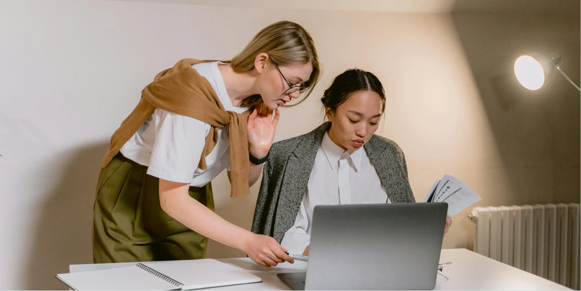 Women working on a computer in a coworking space